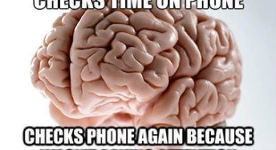 checks time on phone